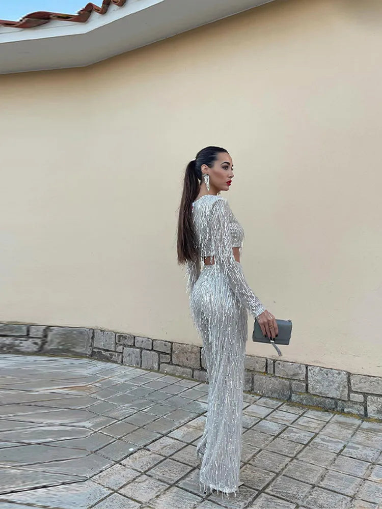 Luxury women's sparkling sequin two-piece outfit, perfect for a memorable evening wear statement.