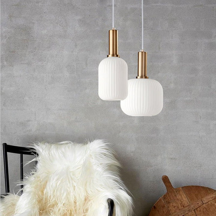 Pendant light with a colored glass shade, creating charming home lighting.