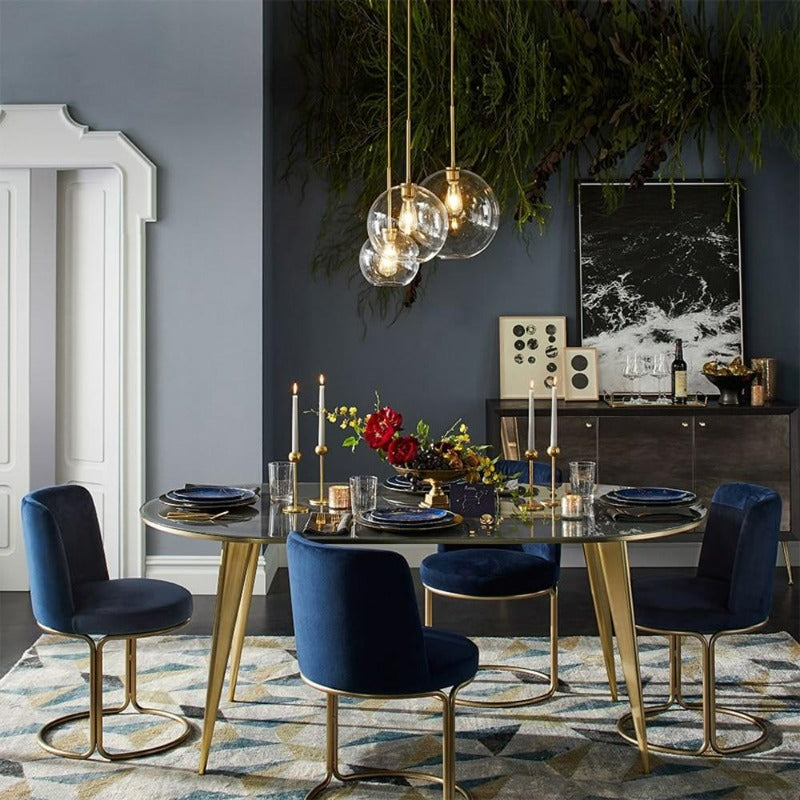 Elegant brass finish modern glass ball pendant light, stylish indoor lighting for living room decor.