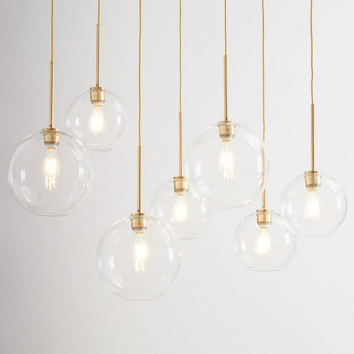 Stylish modern glass sphere pendant light, a chic ceiling fixture for elegant home decor.