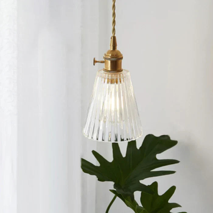 Clear glass pendant light, offers contemporary style and ambient lighting.