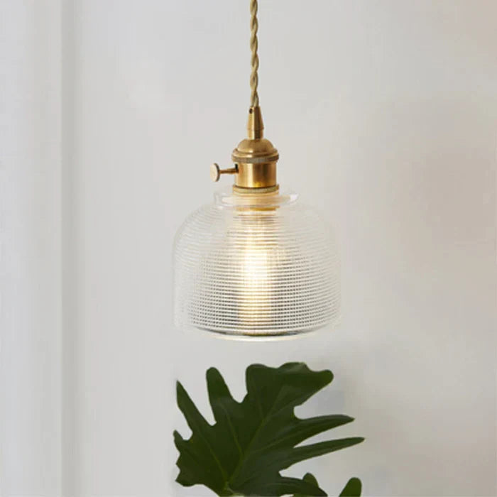 Contemporary hanging glass lamp, brightens dining rooms with elegant light.