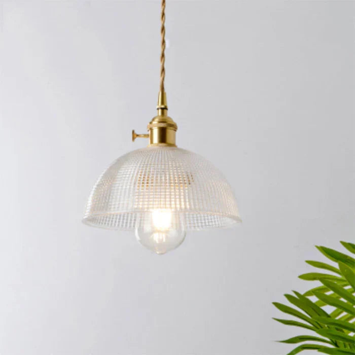 Modern hanging glass pendant light, perfect for contemporary kitchens.