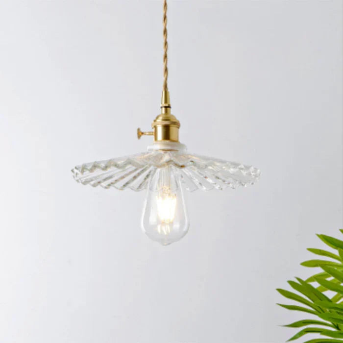 Stylish transparent glass pendant lamp, perfect accent for modern living spaces.