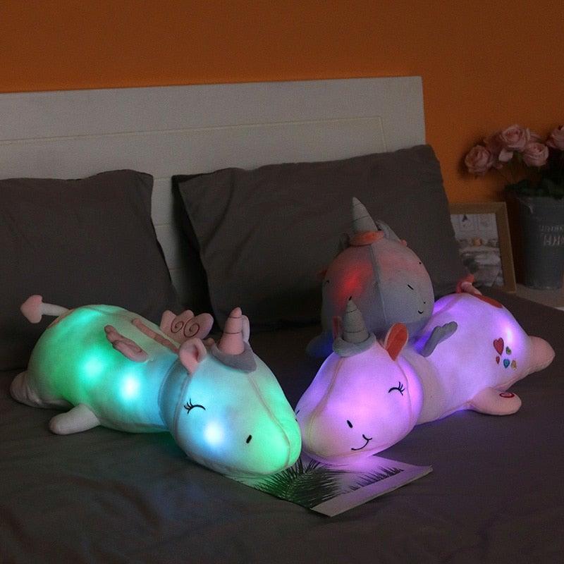 Cuddly light-up unicorn plush, a soft LED stuffed animal providing comforting rainbow glow for bedtime.