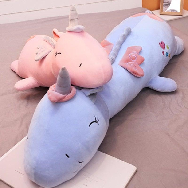 Glowing friend: white unicorn plush with rainbow LED lights, a comforting soft toy for kids' room decor.