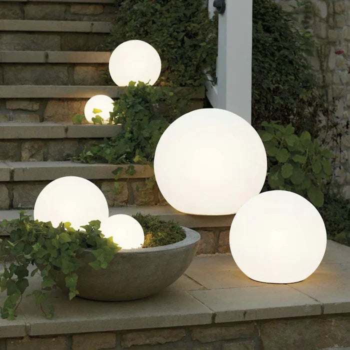 GlowSphere spherical garden light casting warm outdoor ambiance