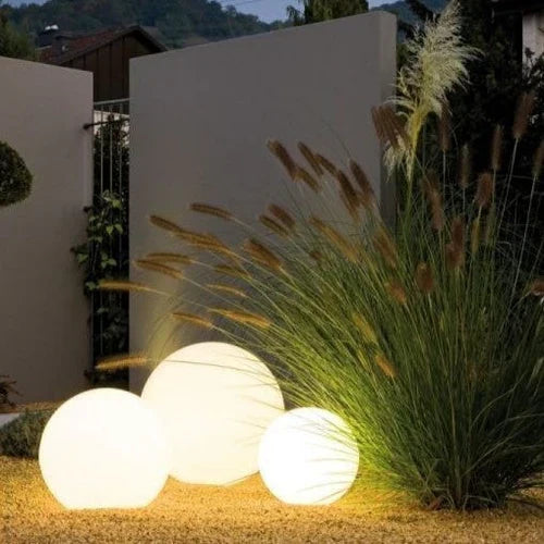 GlowSphere spherical light as a focal point in nighttime garden decor