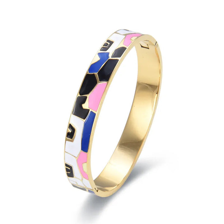 Stylish women's gold cuff bracelet with a beautiful geode and delicate charm, perfect jewellery.