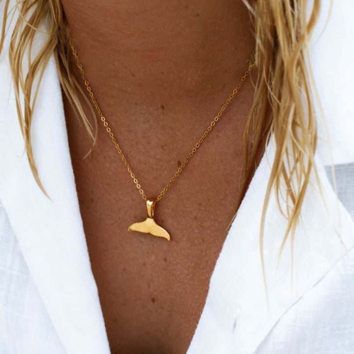Elegant silver whale tail necklace for women, a beautiful marine pendant.