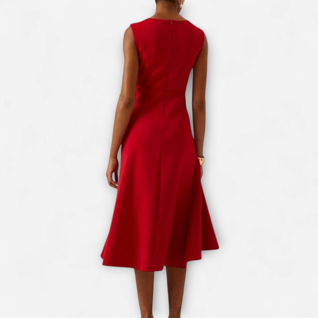 Detailed view of the elegant draping on a women's asymmetric midi dress, perfect for occasionwear.
