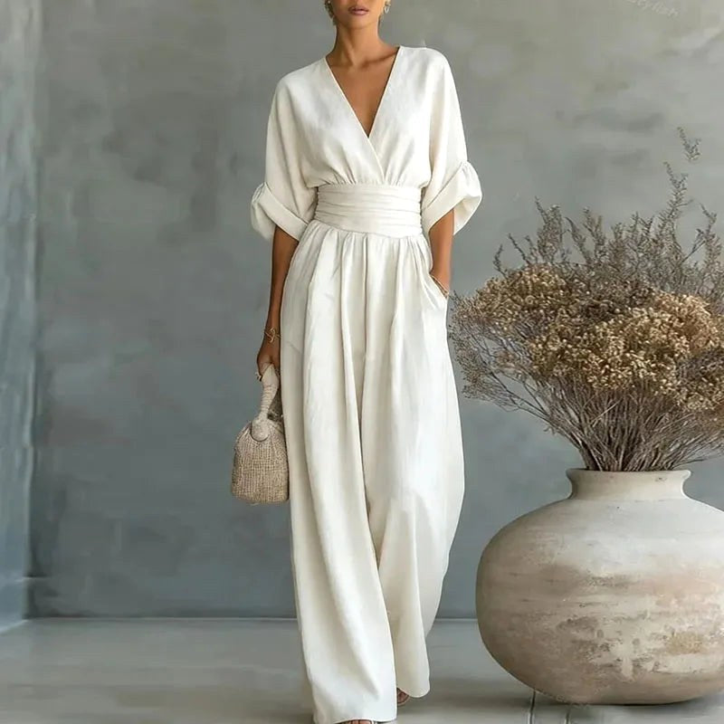 Elegant women's V-neck wide-leg jumpsuit with stylish wrap front, perfect for spring & summer parties.