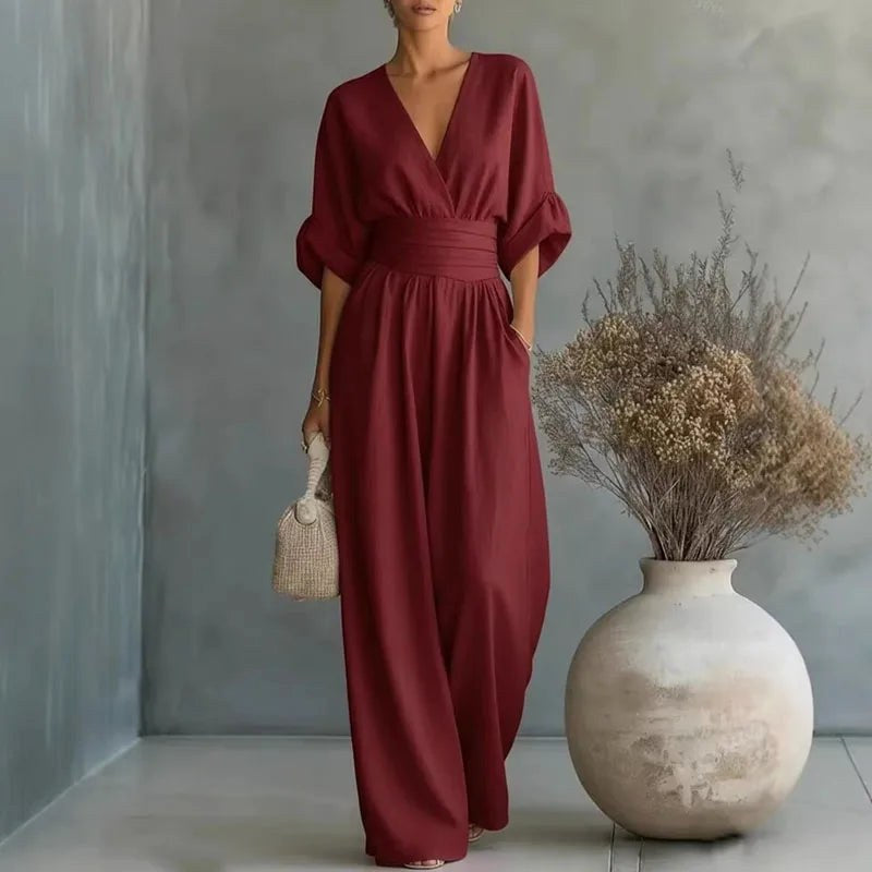 Stylish women's V-neck wide-leg jumpsuit with wrap front, ideal for party outfits & chic summer fashion.