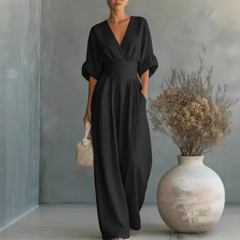 Chic women's wide-leg V-neck jumpsuit featuring a wrap front, a key piece for spring fashion and comfort.