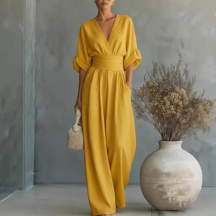 Elegant women's wrap front V-neck wide-leg jumpsuit, a comfortable and versatile one-piece for any event.