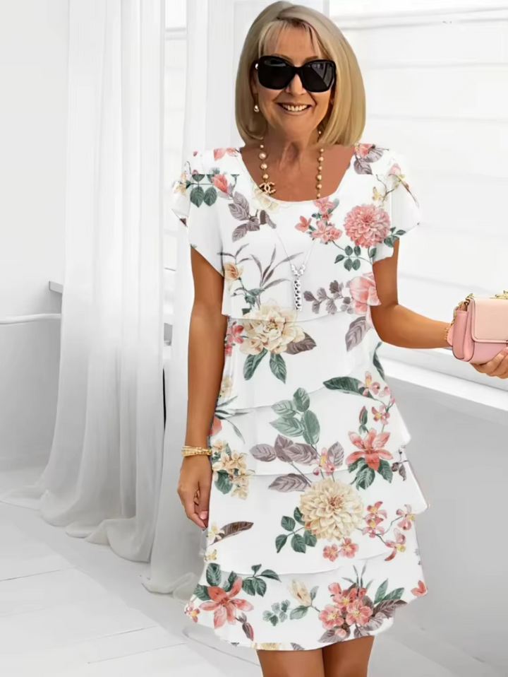 Comfortable women's relaxed fit floral midi dress, a tiered summer dress with flutter sleeves, perfect for casual elegance.
