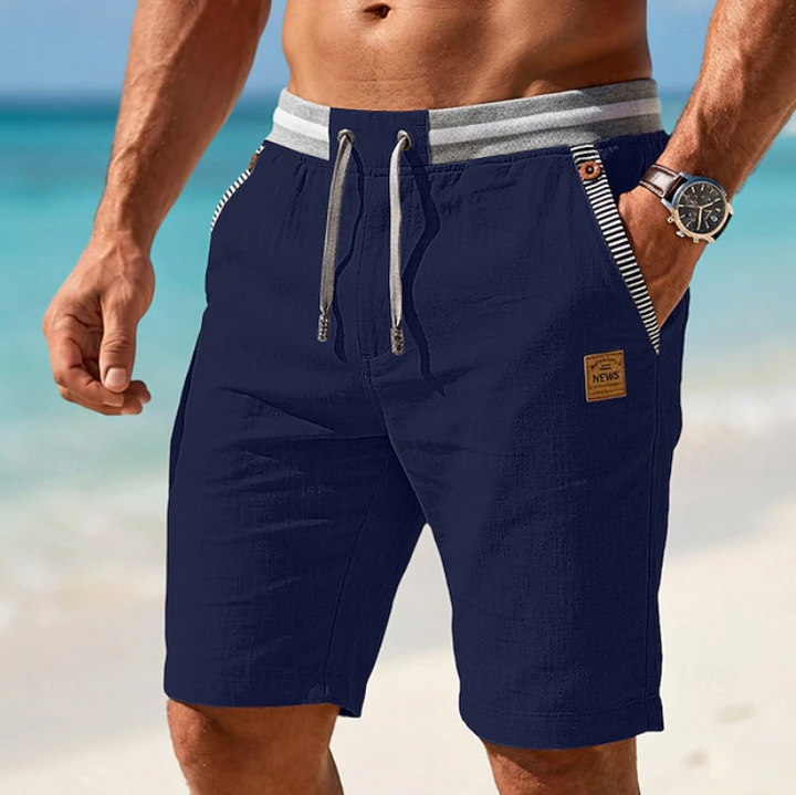 Menswear: comfortable, stylish linen summer shorts with striped trim; perfect relaxed fit for warm weather.