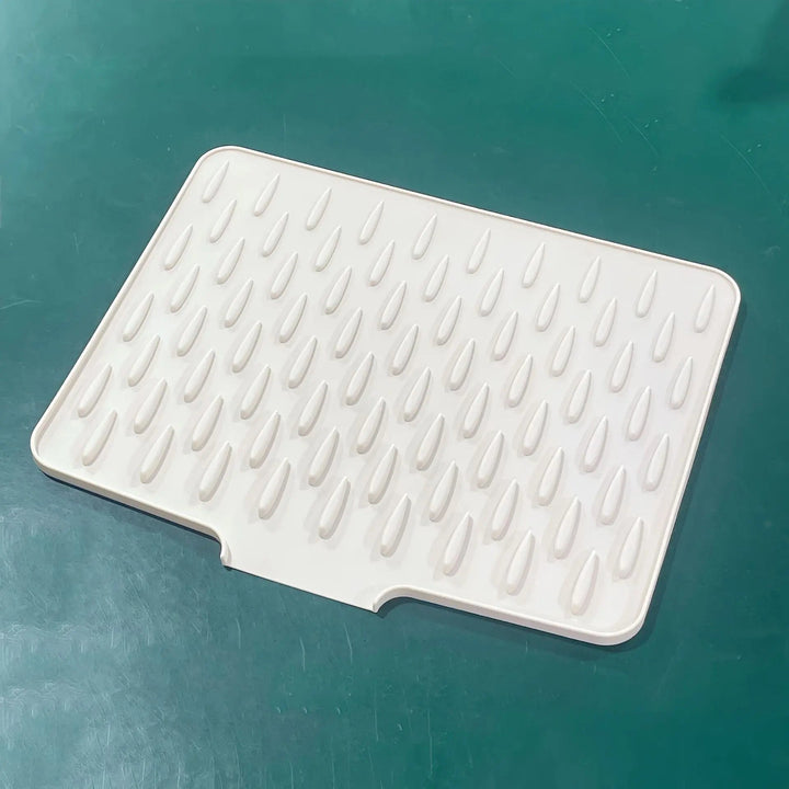 Grey non-slip silicone draining mat for fast dish drying & kitchen counter protection. BPA-free & heat resistant.