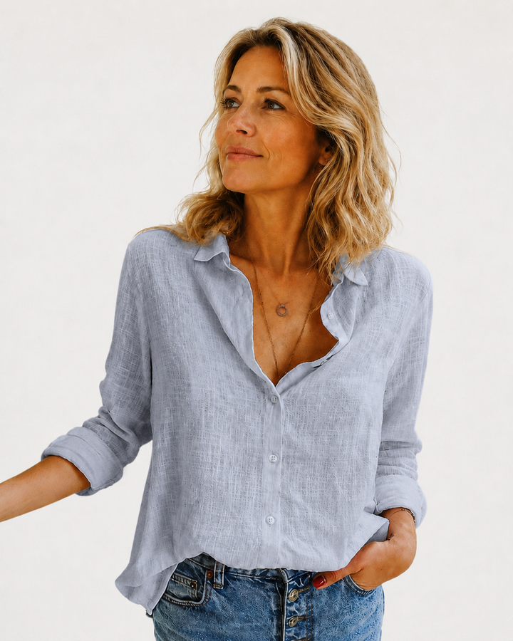 Blue women's long sleeve button-down blouse, an elegant collared top for versatile office and casual fashion.