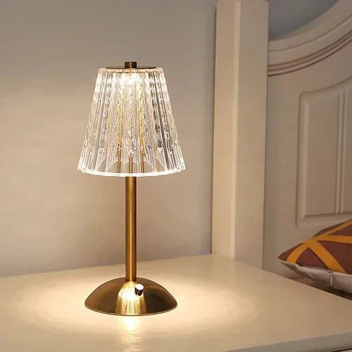 Ambient LED crystal table lamp, rechargeable and portable, with a stylish gold base.