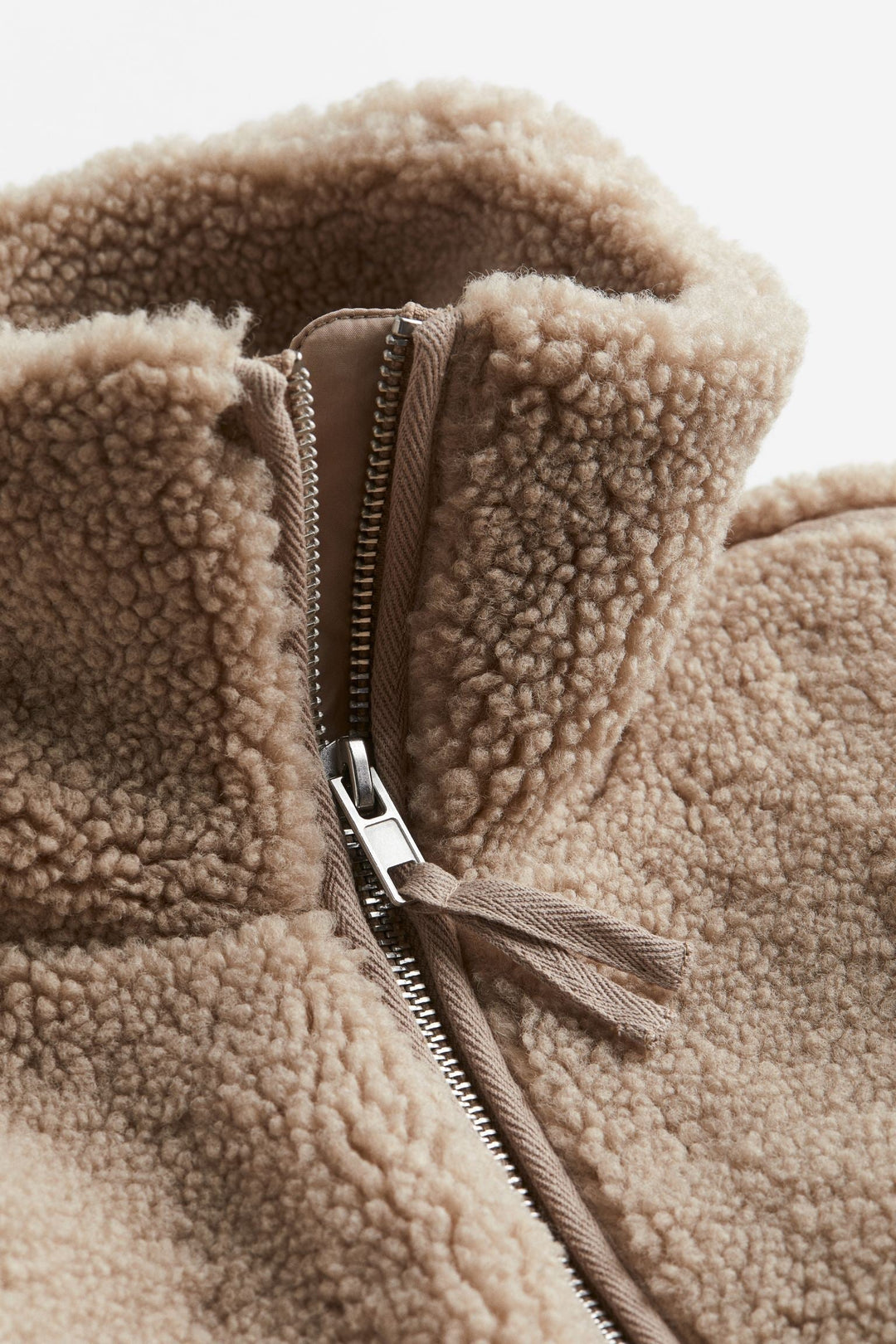 Women's fashion teddy jacket. Offers ultimate winter comfort, warmth, and a stylish relaxed fit for outerwear.