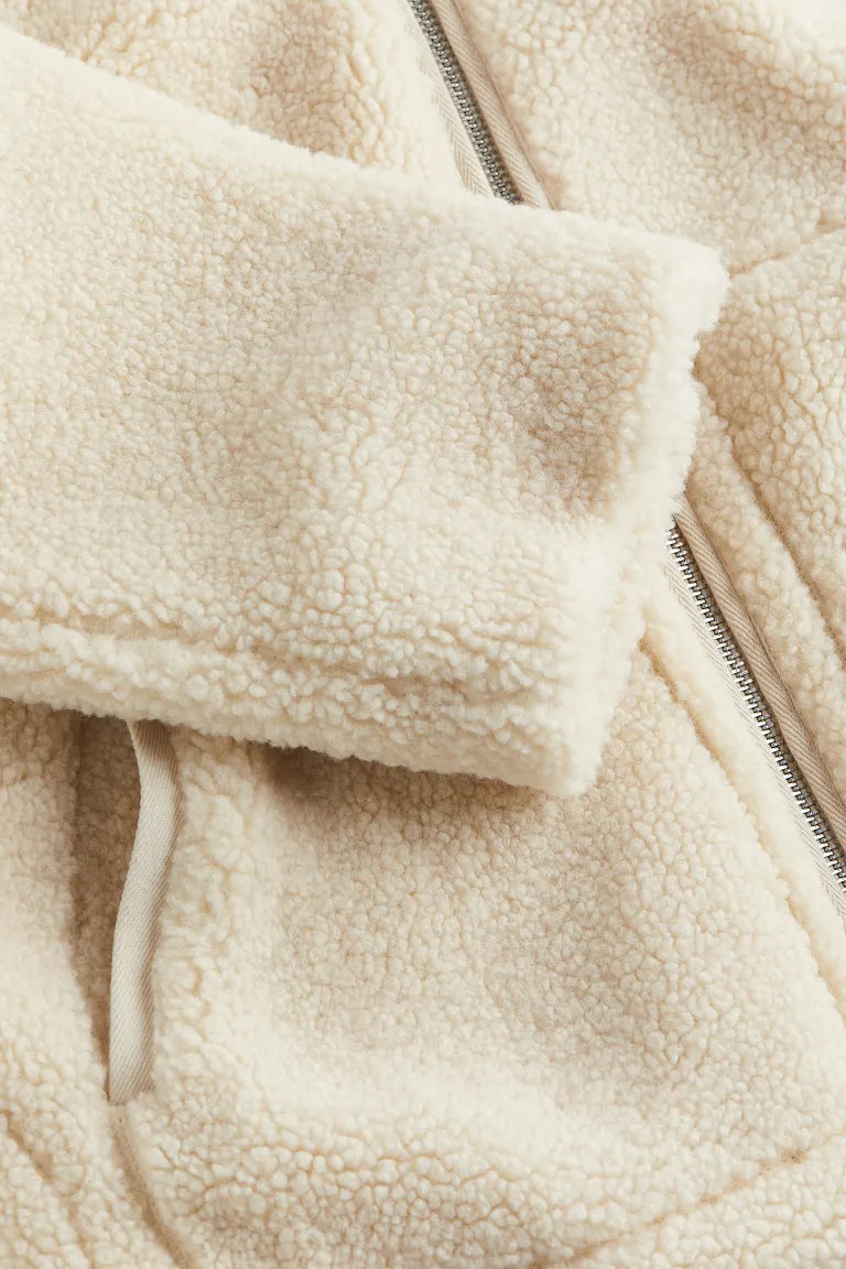 Ultimate winter comfort in this women's cozy teddy jacket. Stylish, warm, and soft outerwear for any cold day.