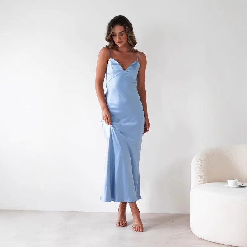 Stylish V-neck midi dress for women, suitable as a wedding guest dress or race day outfit. Formal fashion.