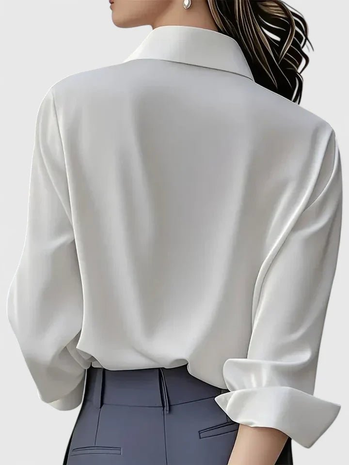 Modern women's long-sleeve blouse with a concealed placket, offering a chic & polished professional look.