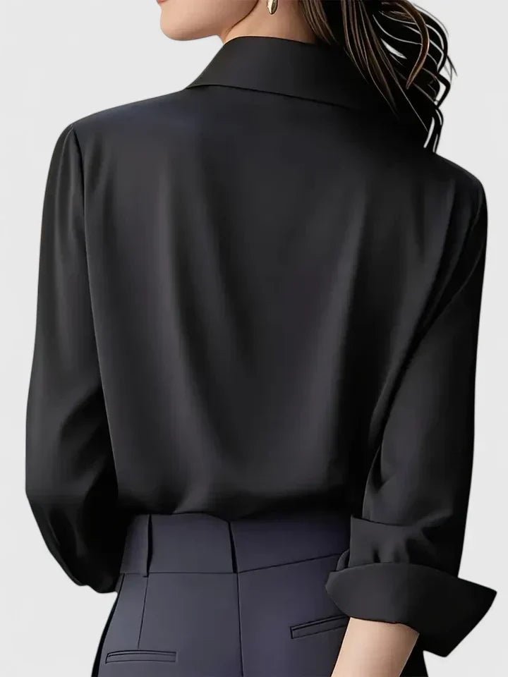 Sophisticated women's blouse, long-sleeve, featuring a clean, concealed button placket. Great for office.