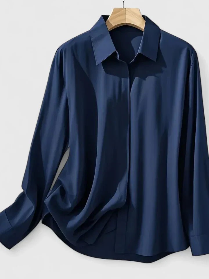 Professional women's long-sleeve blouse with a concealed placket, perfect for sleek workwear attire.