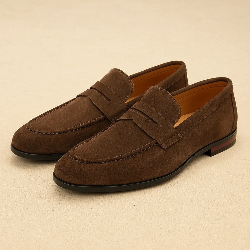 Elegant men's black dress loafers paired with a suit, ideal for formal events and sophisticated occasions.