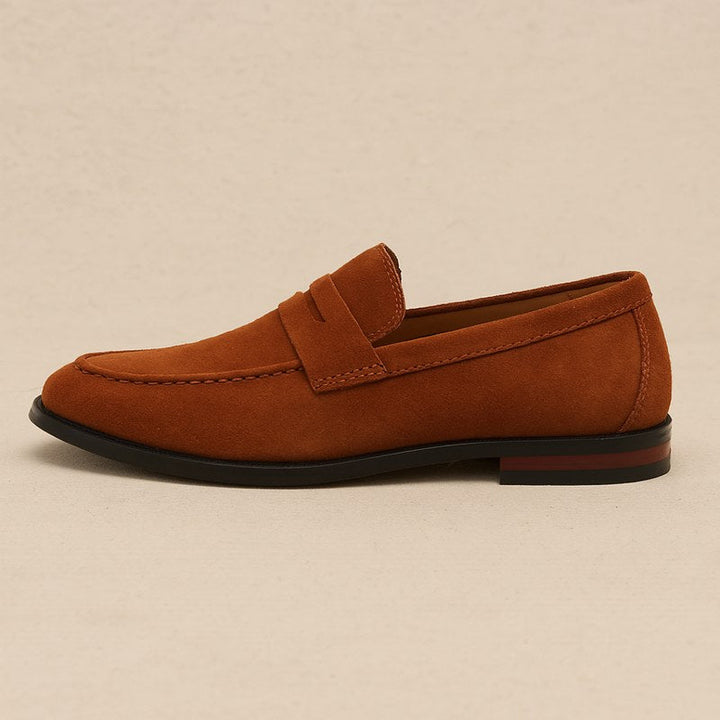 Close-up of classic penny strap on men's versatile slip-on loafers, blending modern style with tradition.