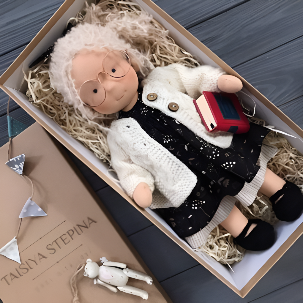 Handmade Waldorf cuddly doll with natural cotton fabric and wool stuffing for imaginative play.