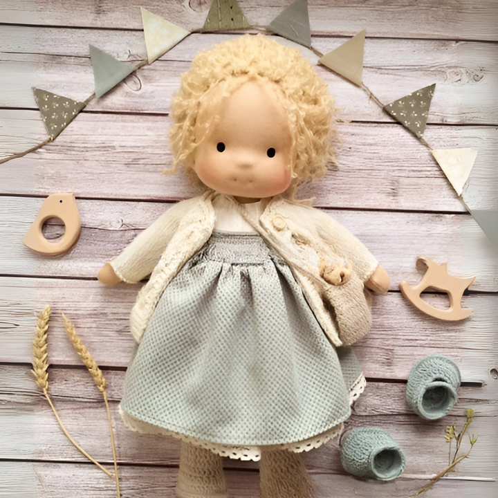 Toddler holding a handmade Waldorf cuddly toy, promoting natural, open-ended play.