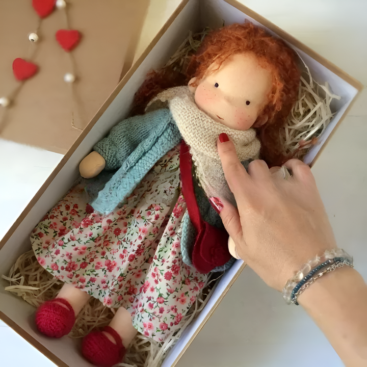 This cotton and wool Waldorf doll is the perfect companion for bedtime stories.