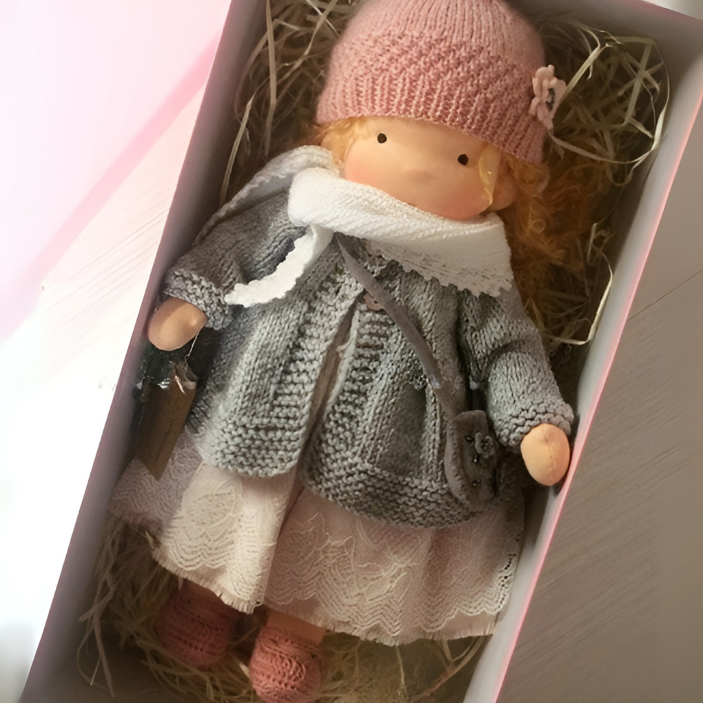 Natural materials highlight in this Waldorf cuddly doll: cotton body, wool stuffing.