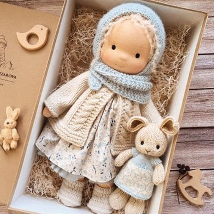 Toddler's fabric Waldorf doll, a handmade and natural playtime companion, ideal gift.