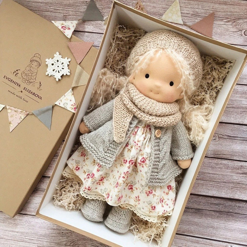 Soft handmade Waldorf doll, a natural fabric toy for children's imaginative play.