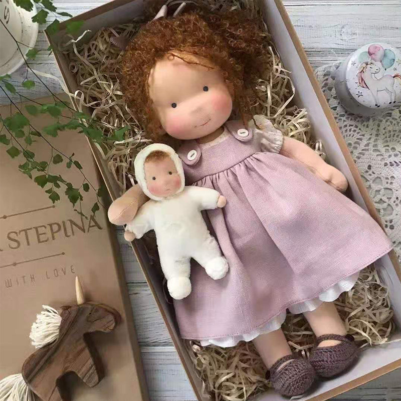 Children's handmade natural Waldorf doll, a soft plush toy for imaginative play & comfort.