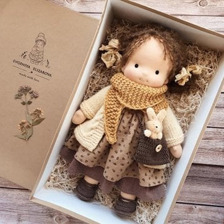 Toddler's natural Waldorf doll, a handmade fabric plush toy, perfect for gentle play.