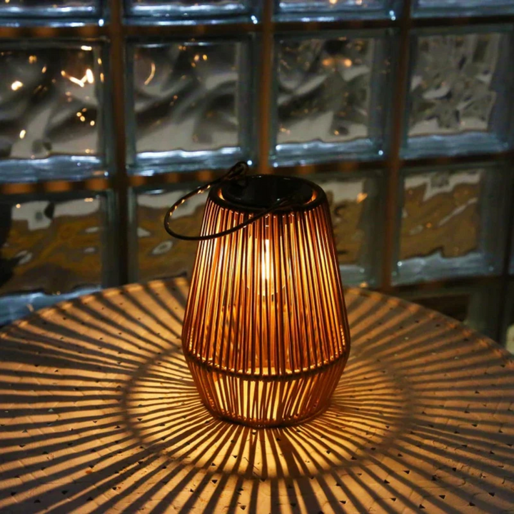 Elegant handwoven rattan solar lantern for patio decor, waterproof LED garden lighting solution.
