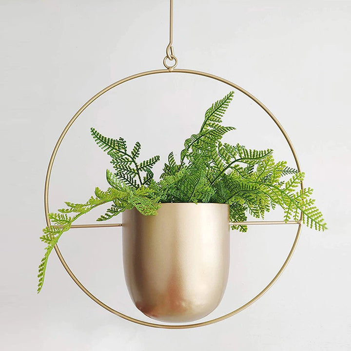 Modern black metal hanging planter pot for indoor & outdoor plants. Stylish home decor & succulent holder.
