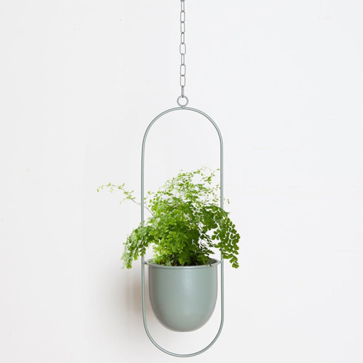 Chic metal hanging planter pot. Modern indoor & outdoor plant holder for stylish home & garden decor.