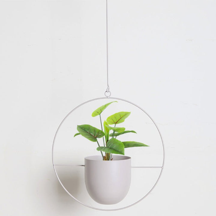 Stylish metal hanging pot, a modern home accent for any room. Perfect for small indoor plants & succulents.
