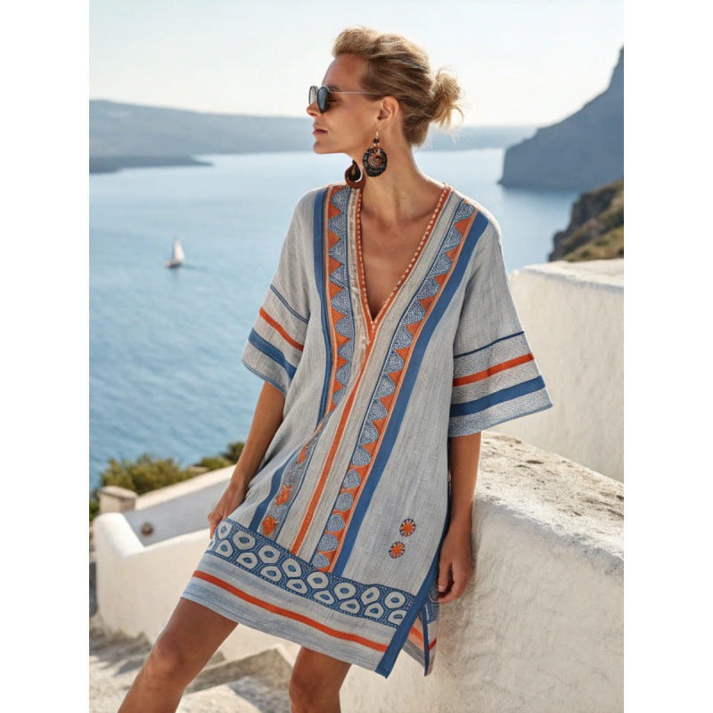 V-neck women's kaftan beach dress, featuring intricate embroidery & a relaxed bohemian fit.