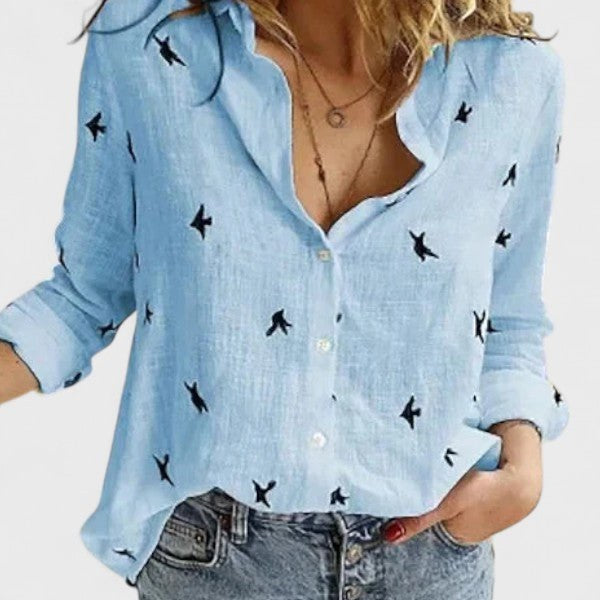 Close-up of the lapel collar and buttons on a versatile women's long sleeve button-down shirt.