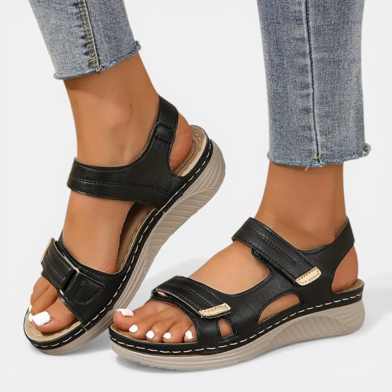 Women's orthopedic slip-on sandals, black, with arch support for all-day comfort.