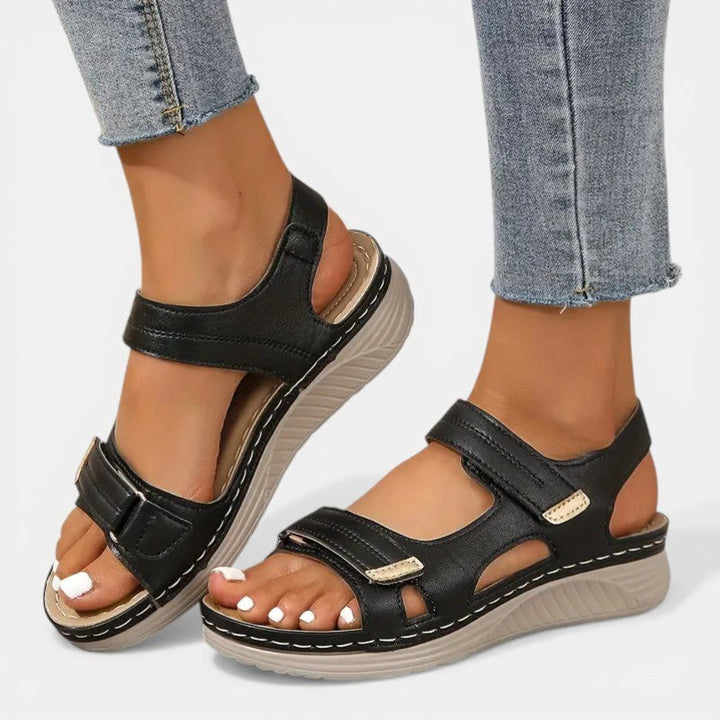 Women's orthopedic slip-on sandals, black, with arch support for all-day comfort.