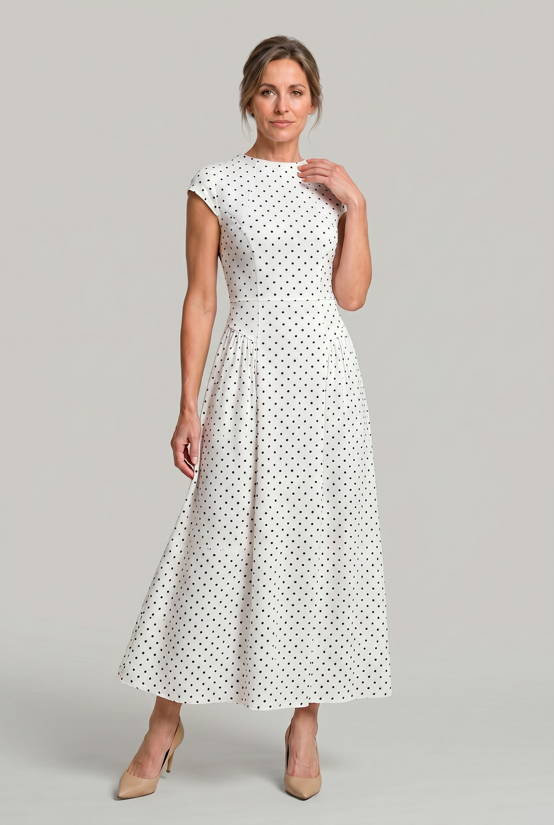 Women's classic black & white polka dot A-line maxi dress with cap sleeves & round neck, perfect for summer parties.