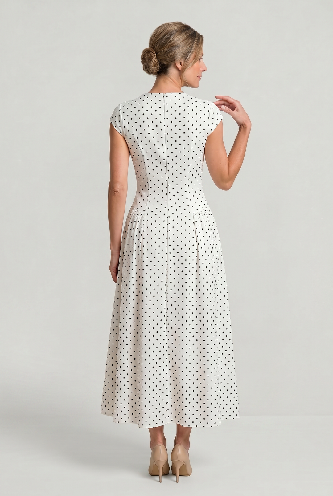 Flowy women's polka dot A-line maxi dress, classic design with cap sleeves. Perfect elegant summer garden party dress.